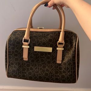 Matching Calvin Klein bag and wallet, new and clean worn few times.